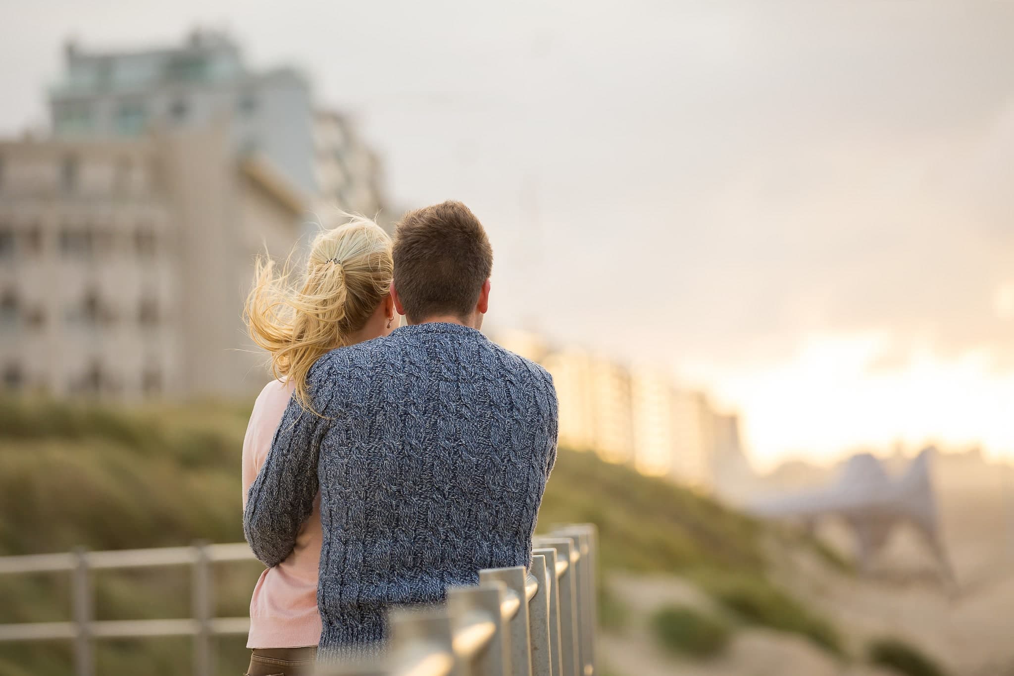 Young couple wathing at the coast